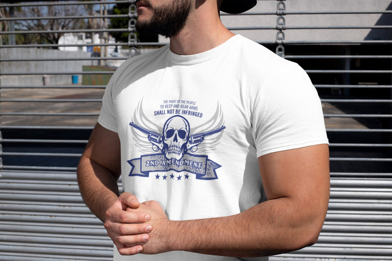 Man wearing a 2nd Amendment Rebel With a Cause Patriotic American Short Sleeve Crew Neck White T-Shirt that features a skull with revolvers in wings with the words the right of the people to keep and bear arms shall not be infringed