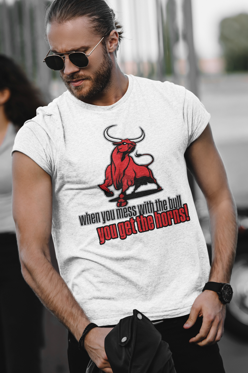 a man with sunglasses wearing a heathered gray crew neck t-shirt featuring a standing red bull with the saying when you mess with the bull you get the horns